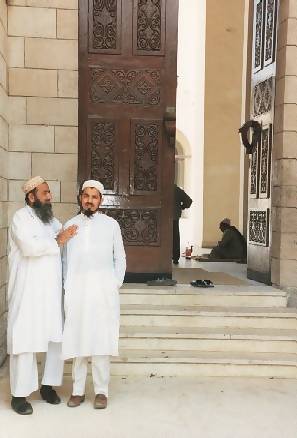 men by a mosque