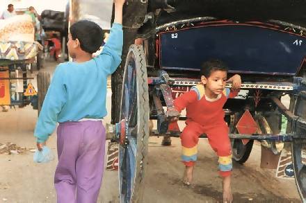 kids playing on a carriage=